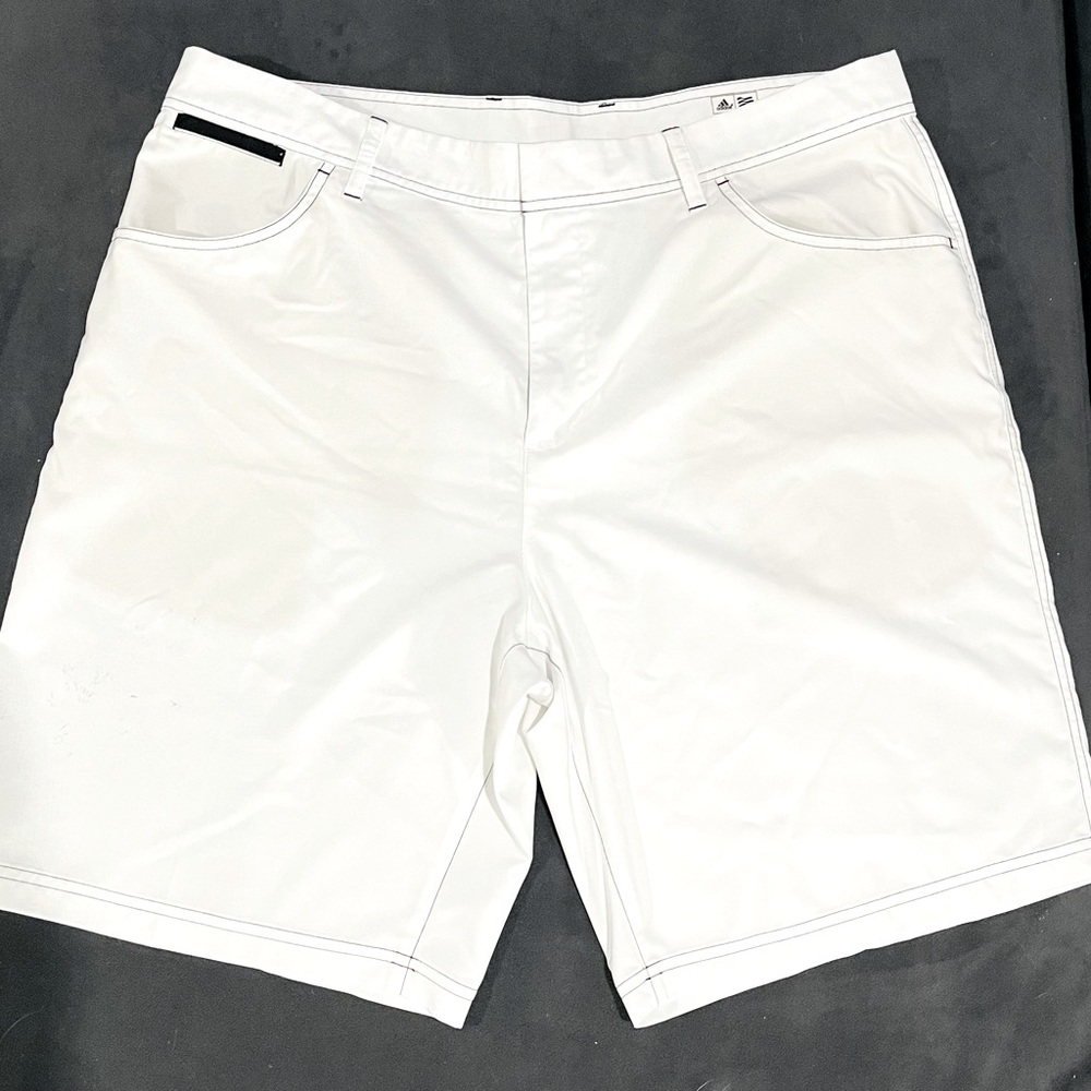 White and black adidas golf pants